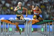 23 August 2023; Sarah Lavin of Ireland, left, competes in the women's 100m hurdles during day five of the World Athletics Championships at the National Athletics Centre in Budapest, Hungary. Photo by Sam Barnes/Sportsfile
