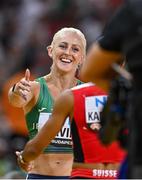 23 August 2023; Sarah Lavin of Ireland, left, is embraced by Mujinga Kambundji of Switzerland after competing in the women's 100m hurdles heats during day five of the World Athletics Championships at the National Athletics Centre in Budapest, Hungary. Photo by Sam Barnes/Sportsfile