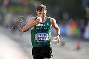 24 August 2023; Brendan Boyce of Ireland cools himself down at a water station during the men's 35km walk during day six of the World Athletics Championships in Budapest, Hungary. Photo by Sam Barnes/Sportsfile