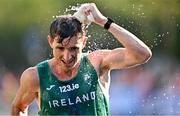 24 August 2023; Brendan Boyce of Ireland cools himself down at a water station during the men's 35km walk during day six of the World Athletics Championships in Budapest, Hungary. Photo by Sam Barnes/Sportsfile