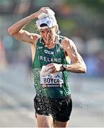 24 August 2023; Brendan Boyce of Ireland cools himself down at a water station during the men's 35km walk during day six of the World Athletics Championships in Budapest, Hungary. Photo by Sam Barnes/Sportsfile