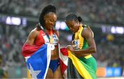 24 August 2023; World champion Danielle Williams of Jamaica, right, and silver medallist Jasmine Camacho-Quinn of Peru celebrate after the women's 100m hurdles final during day six of the World Athletics Championships at the National Athletics Centre in Budapest, Hungary. Photo by Sam Barnes/Sportsfile