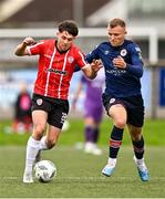 20 August 2023; Adam O'Reilly of Derry City and Jamie Lennon of St Patrick's Athletic during the Sports Direct Men’s FAI Cup Second Round match between Derry City and St Patrick’s Athletic at The Ryan McBride Brandywell Stadium in Derry. Photo by Ben McShane/Sportsfile