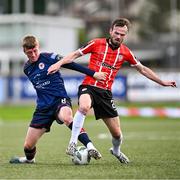 20 August 2023; Chris Forrester of St Patrick's Athletic and Cameron Dummigan of Derry City during the Sports Direct Men’s FAI Cup Second Round match between Derry City and St Patrick’s Athletic at The Ryan McBride Brandywell Stadium in Derry. Photo by Ben McShane/Sportsfile