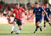 20 August 2023; Ben Doherty of Derry City and Vladislav Kreida of St Patrick's Athletic during the Sports Direct Men’s FAI Cup Second Round match between Derry City and St Patrick’s Athletic at The Ryan McBride Brandywell Stadium in Derry. Photo by Ben McShane/Sportsfile