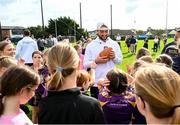 25 August 2023; Notre Dame running back Sam Assaf, centre, with young Kilmacud Crokes players during a Notre Dame Football Clinic at Kilmacud Crokes GAA in Dublin, ahead of the Aer Lingus College Football Classic match between Notre Dame and Navy at the Aviva Stadium in Dublin. Photo by David Fitzgerald/Sportsfile