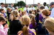 25 August 2023; Notre Dame running back Sam Assaf, centre, with young Kilmacud Crokes players during a Notre Dame Football Clinic at Kilmacud Crokes GAA in Dublin, ahead of the Aer Lingus College Football Classic match between Notre Dame and Navy at the Aviva Stadium in Dublin. Photo by David Fitzgerald/Sportsfile