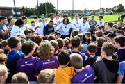 25 August 2023; Notre Dame defensive lineman Devan Houstan, centre, with young Kilmacud Crokes players during a Notre Dame Football Clinic at Kilmacud Crokes GAA in Dublin, ahead of the Aer Lingus College Football Classic match between Notre Dame and Navy at the Aviva Stadium in Dublin. Photo by David Fitzgerald/Sportsfile