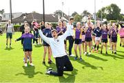 25 August 2023; Notre Dame kicker Marcello Diomede with young Kilmacud Crokes players during a Notre Dame Football Clinic at Kilmacud Crokes GAA in Dublin, ahead of the Aer Lingus College Football Classic match between Notre Dame and Navy at the Aviva Stadium in Dublin. Photo by David Fitzgerald/Sportsfile
