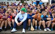25 August 2023; Notre Dame linebacker Jerry Rullo with young Kilmacud Crokes players during a Notre Dame Football Clinic at Kilmacud Crokes GAA in Dublin, ahead of the Aer Lingus College Football Classic match between Notre Dame and Navy at the Aviva Stadium in Dublin. Photo by David Fitzgerald/Sportsfile