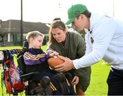 25 August 2023; Fionn Ó Heineachain, age 8, with Notre Dame linebacker Jerry Rullo during a Notre Dame Football Clinic at Kilmacud Crokes GAA in Dublin, ahead of the Aer Lingus College Football Classic match between Notre Dame and Navy at the Aviva Stadium in Dublin. Photo by David Fitzgerald/Sportsfile