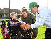 25 August 2023; Fionn Ó Heineachain, age 8, with Notre Dame linebacker Jerry Rullo during a Notre Dame Football Clinic at Kilmacud Crokes GAA in Dublin, ahead of the Aer Lingus College Football Classic match between Notre Dame and Navy at the Aviva Stadium in Dublin. Photo by David Fitzgerald/Sportsfile