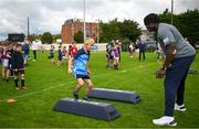 25 August 2023; Young Kilmacud Crokes players during a Notre Dame Football Clinic at Kilmacud Crokes GAA in Dublin, ahead of the Aer Lingus College Football Classic match between Notre Dame and Navy at the Aviva Stadium in Dublin. Photo by David Fitzgerald/Sportsfile