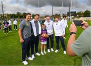 25 August 2023 Kilmacud Crokes player Luke Burns, age 10, with players during a Notre Dame Football Clinic at Kilmacud Crokes GAA in Dublin, ahead of the Aer Lingus College Football Classic match between Notre Dame and Navy at the Aviva Stadium in Dublin. Photo by David Fitzgerald/Sportsfile