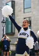 25 August 2023; Navy cheerleader Emily Coates performs a routine at the prestigious Ireland-US CEO Club Lunch, hosted in association with the Aer Lingus College Football Classic, at the Mansion House in Dublin. The lunch offered the perfect entreé to a weekend of fierce football competition as Notre Dame face off against the US Naval Academy at the Aviva Stadium to open the 2023 College Football season. Photo by Brendan Moran/Sportsfile