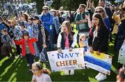 25 August 2023; Fia Brady, age 7, from Wexford, centre, at the Navy Pep Rally at Merrion Square, Dublin ahead of the Aer Lingus College Football Classic match between Notre Dame and Navy at the Aviva Stadium in Dublin. Photo by David Fitzgerald/Sportsfile