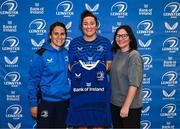 25 August 2023; Team captain Hannah O'Connor is presented with her jersey by head coach Tania Rosser and former Leinster and Ireland rugby player Yvonne Nolan, right, during a Leinster Rugby Women's jersey presentation at Old Belvedere RFC in Dublin. Photo by Piaras Ó Mídheach/Sportsfile