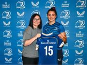 25 August 2023; Natasja Behan is presented with her jersey by former Leinster and Ireland rugby player Yvonne Nolan during a Leinster Rugby Women's jersey presentation at Old Belvedere RFC in Dublin. Photo by Piaras Ó Mídheach/Sportsfile