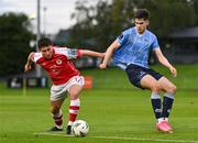 25 August 2023; Kian leavy of St Patrick's Athletic in action against Adam Verdon of UCD during the SSE Airtricity Men's Premier Division match between UCD and St Patrick's Athletic at UCD Bowl in Dublin. Photo by Tyler Miller/Sportsfile