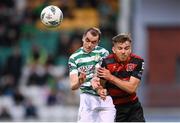 25 August 2023; Sean Kavanagh of Shamrock Rovers and Archie Davies of Dundalk compete for the ball during the SSE Airtricity Men's Premier Division match between Shamrock Rovers and Dundalk at Tallaght Stadium in Dublin. Photo by Seb Daly/Sportsfile