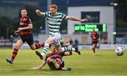 25 August 2023; Rory Gaffney of Shamrock Rovers is tackled by Louie Annesley of Dundalk during the SSE Airtricity Men's Premier Division match between Shamrock Rovers and Dundalk at Tallaght Stadium in Dublin. Photo by Seb Daly/Sportsfile