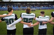 25 August 2023; Members of the Wolfhounds team stand together for the national anthems before the Global Ireland Football Tournament Game between AFI Jr Wolfhounds and Community School of Naples at Energia Park in Dublin, ahead of the Aer Lingus College Football Classic match between Notre Dame and Navy in Dublin. Photo by Brendan Moran/Sportsfile