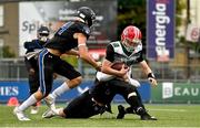 25 August 2023; Wolfhounds quarterback Zac McDowell is tackled by the Naples defence during the Global Ireland Football Tournament Game between AFI Jr Wolfhounds and Community School of Naples at Energia Park in Dublin, ahead of the Aer Lingus College Football Classic match between Notre Dame and Navy in Dublin. Photo by Brendan Moran/Sportsfile