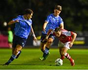 25 August 2023; Anto Breslin of St Patrick's Athletic is tackled by  Donal Higgins of UCD during the SSE Airtricity Men's Premier Division match between UCD and St Patrick's Athletic at UCD Bowl in Dublin. Photo by Tyler Miller/Sportsfile