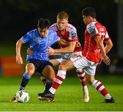 25 August 2023; Danú Bishop Kinsella of UCD is tackled by Jay McGrath, centre, and Kian Leavy of St Patrick's Athletic during the SSE Airtricity Men's Premier Division match between UCD and St Patrick's Athletic at UCD Bowl in Dublin. Photo by Tyler Miller/Sportsfile
