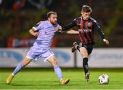 25 August 2023; Paddy Kirk of Bohemians in action against Paul McMullan of Derry City during the SSE Airtricity Men's Premier Division match between Bohemians and Derry City at Dalymount Park in Dublin. Photo by Stephen McCarthy/Sportsfile