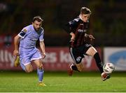 25 August 2023; Paddy Kirk of Bohemians in action against Paul McMullan of Derry City during the SSE Airtricity Men's Premier Division match between Bohemians and Derry City at Dalymount Park in Dublin. Photo by Stephen McCarthy/Sportsfile