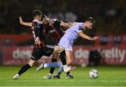 25 August 2023; Will Patching of Derry City in action against Ali Coote, left, and Jordan Flores of Bohemians  during the SSE Airtricity Men's Premier Division match between Bohemians and Derry City at Dalymount Park in Dublin. Photo by Stephen McCarthy/Sportsfile