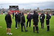 25 August 2023; Officials discuss a floodlight failure before agreed to delay the start of the SSE Airtricity Men's Premier Division match between Bohemians and Derry City at Dalymount Park in Dublin. Photo by Stephen McCarthy/Sportsfile