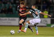 25 August 2023; Connor Malley of Dundalk in action against Graham Burke of Shamrock Rovers during the SSE Airtricity Men's Premier Division match between Shamrock Rovers and Dundalk at Tallaght Stadium in Dublin. Photo by Seb Daly/Sportsfile