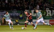25 August 2023; Daniel Kelly of Dundalk in action against Shamrock Rovers players Sean Kavanagh, left, and Markus Poom during the SSE Airtricity Men's Premier Division match between Shamrock Rovers and Dundalk at Tallaght Stadium in Dublin. Photo by Seb Daly/Sportsfile