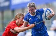 26 August 2023; Clara Dunne of Leinster is tackled by Lyndsay Clarke of Munster during the Girls Interprovincial Championship match between Leinster and Munster at Energia Park in Dublin. Photo by Piaras Ó Mídheach/Sportsfile
