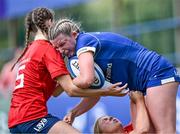 26 August 2023; Clara Dunne of Leinster is tackled by Niamh Crotty, left, and Lyndsay Clarke of Munster during the Girls Interprovincial Championship match between Leinster and Munster at Energia Park in Dublin. Photo by Piaras Ó Mídheach/Sportsfile