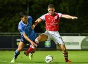 25 August 2023; Anto Breslin of St Patrick's Athletic in action against Sean Brennan of UCD during the SSE Airtricity Men's Premier Division match between UCD and St Patrick's Athletic at UCD Bowl in Dublin. Photo by Tyler Miller/Sportsfile