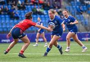 26 August 2023; Kate Noons of Leinster in action against Emma Dunican of Munster during the Girls Interprovincial Championship match between Leinster and Munster at Energia Park in Dublin. Photo by Piaras Ó Mídheach/Sportsfile