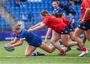 26 August 2023; Kate Noons of Leinster scores her side's fourth try, under pressure from Tuathla Ryan of Munster, during the Girls Interprovincial Championship match between Leinster and Munster at Energia Park in Dublin. Photo by Piaras Ó Mídheach/Sportsfile