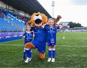 26 August 2023; Leo the Lion with mascots Alex O'Friel and Aoibheann Geoghegan before the Vodafone Women’s Interprovincial Championship match between Leinster and Munster at Energia Park in Dublin. Photo by Piaras Ó Mídheach/Sportsfile