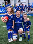 26 August 2023; Leinster captain Hannah O'Connor with mascots Aoibheann Geoghegan and Alex O'Friel before the Vodafone Women’s Interprovincial Championship match between Leinster and Munster at Energia Park in Dublin. Photo by Piaras Ó Mídheach/Sportsfile
