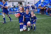26 August 2023; Leinster captain Hannah O'Connor with mascots Aoibheann Geoghegan and Alex O'Friel before the Vodafone Women’s Interprovincial Championship match between Leinster and Munster at Energia Park in Dublin. Photo by Piaras Ó Mídheach/Sportsfile