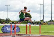 26 August 2023; Dara Harty from Spa-Fenit-Barrow, Kerry jumps the last on his way to winning the Boys under-14 80m Hurdles during the Community Games National Track and Field finals at Carlow SETU in Carlow. Photo by Matt Browne/Sportsfile