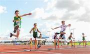 26 August 2023; Aidian McNamara, right, from Eadestown, Kildare races ahead of Seamus Hallissey, left, from Cahersiveen, Kerry and Fionn Browne, right, from Bennekerry-Tinryland, Carlow in the boys under-10 60m Hurdle Final during the Community Games National Track and Field finals at Carlow SETU in Carlow. Photo by Matt Browne/Sportsfile