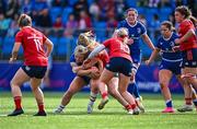 26 August 2023; Aoife Dalton of Leinster is tackled by Alana McInerney and Kate Flannery, 10, of Munster during the Vodafone Women’s Interprovincial Championship match between Leinster and Munster at Energia Park in Dublin. Photo by Piaras Ó Mídheach/Sportsfile