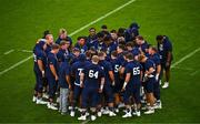 26 August 2023; Navy players form a huddle before the Aer Lingus College Football Classic match between Notre Dame and Navy Midshipmen at the Aviva Stadium in Dublin. Photo by Ben McShane/Sportsfile