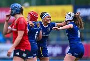 26 August 2023; Leinster players, from left, Aoife Wafer, Eimear Corri and Sarah Delaney celebrate after their side's victory in the Vodafone Women’s Interprovincial Championship match between Leinster and Munster at Energia Park in Dublin. Photo by Piaras Ó Mídheach/Sportsfile
