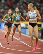 26 August 2023; Sharlene Mawdsley of Ireland, left, is passed the baton by Kelly McGrory while competing in the women's 4x400m during day eight of the World Athletics Championships at the National Athletics Centre in Budapest, Hungary. Photo by Sam Barnes/Sportsfile