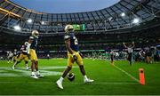26 August 2023; Notre Dame running back Jadarian Price, centre, celebrates after scoring his side's second touchdown during the Aer Lingus College Football Classic match between Notre Dame and Navy Midshipmen at the Aviva Stadium in Dublin. Photo by Brendan Moran/Sportsfile